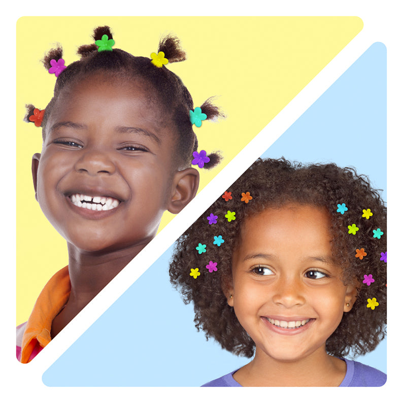 Two smiling girls wearing kids flower hair clips in bright assorted colors for playful hairstyles
