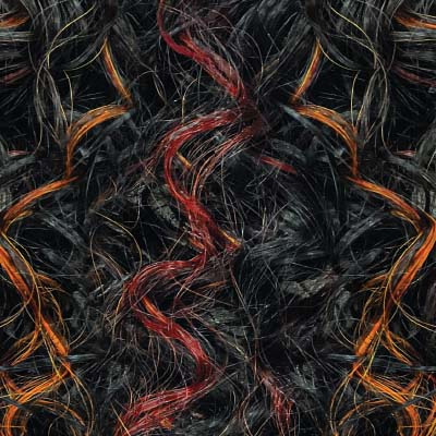 Close-up of OUTRE lace front synthetic wig with black base and orange and red curly strands