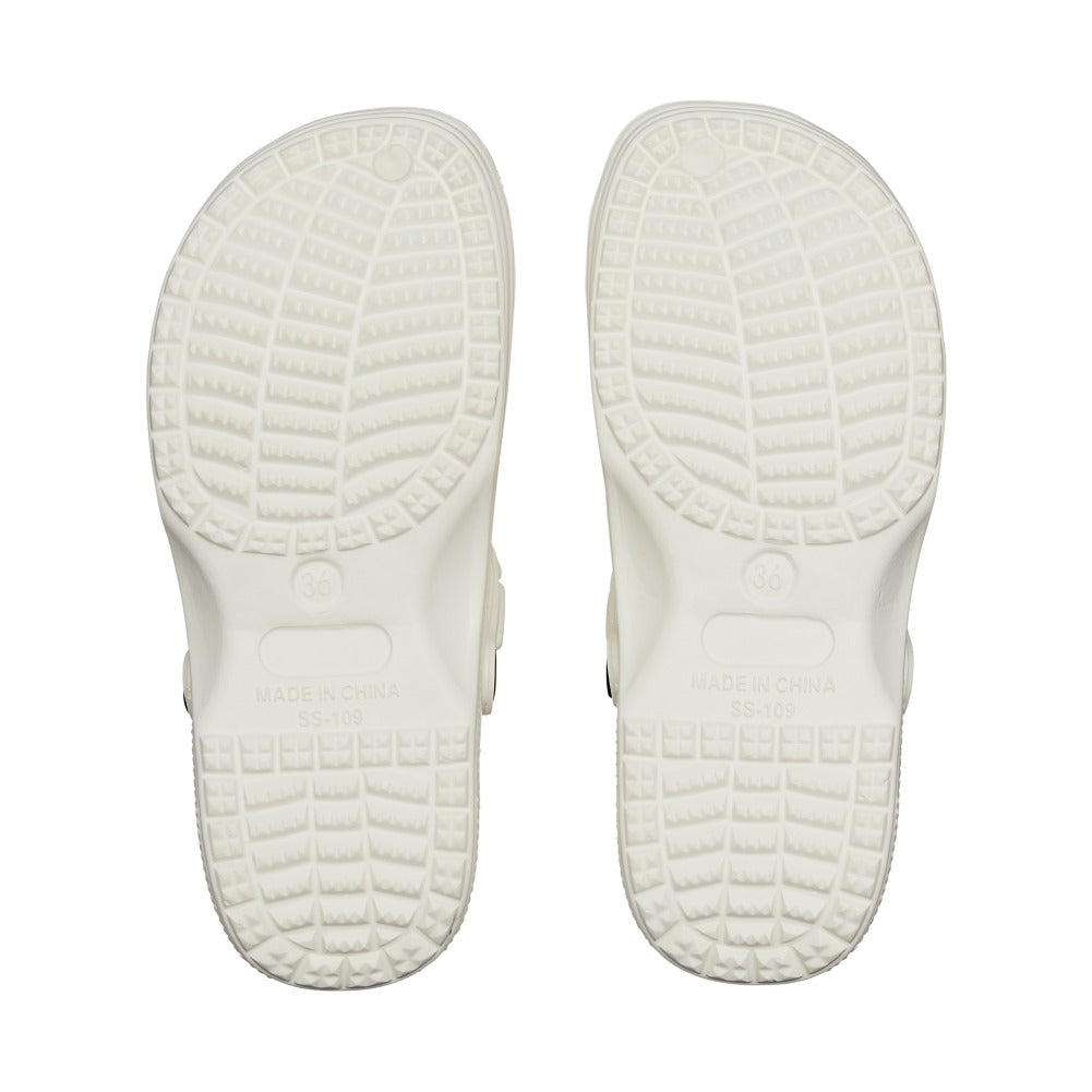 Pair of white air clog shoes shown from bottom view with textured slip resistant tread and molded sole