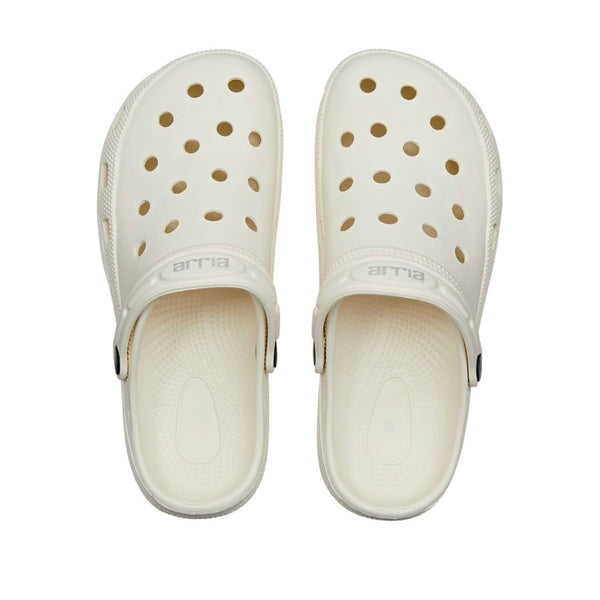 Top view of white air clog shoes with ventilation holes adjustable heel strap textured footbed