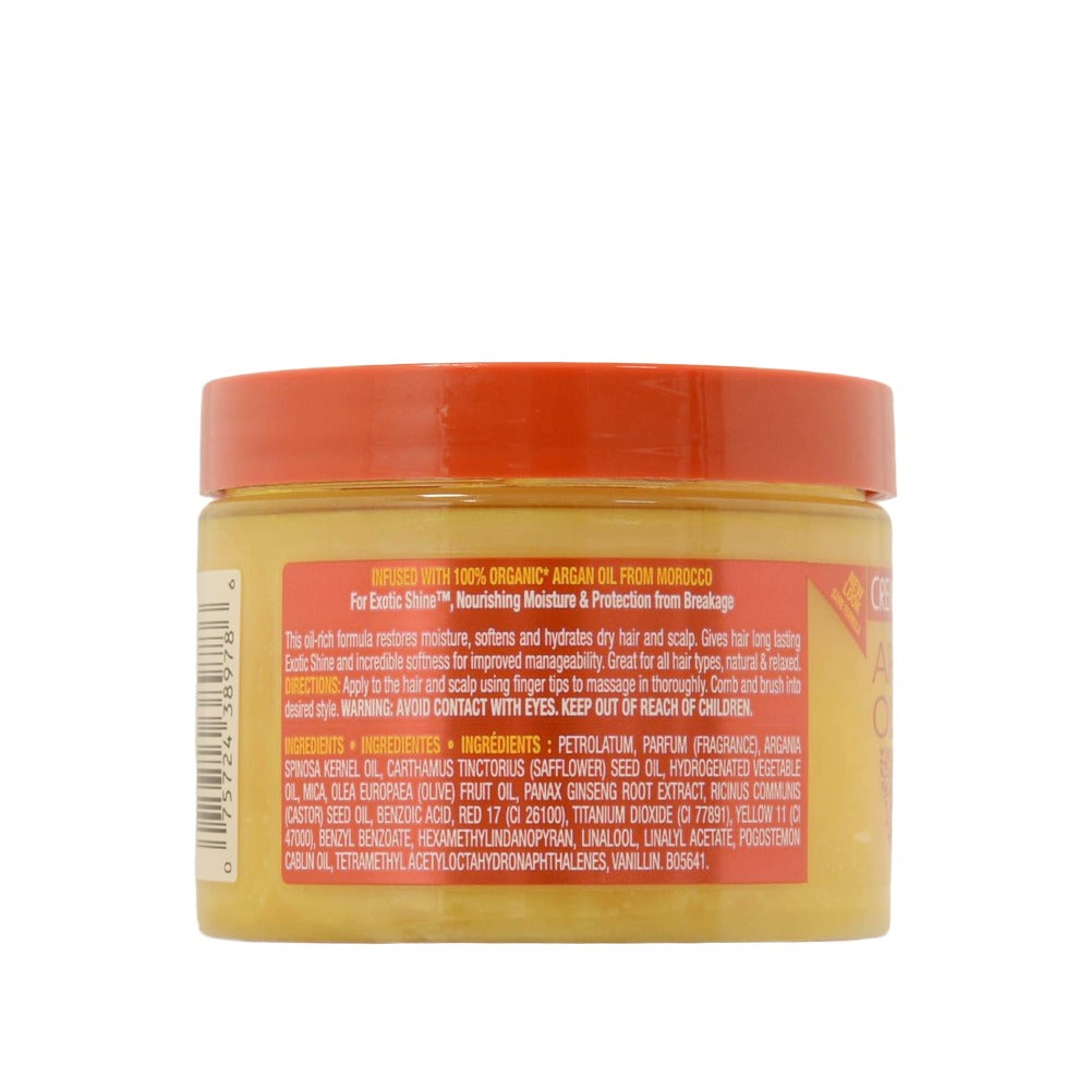 CREME OF NATURE day and night hair and scalp conditioner jar showing back label with yellow cream and orange lid