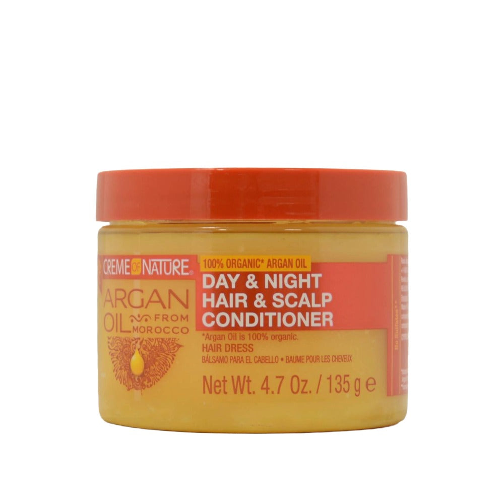 Creme of Nature argan oil day and night hair and scalp conditioner in yellow jar with orange lid