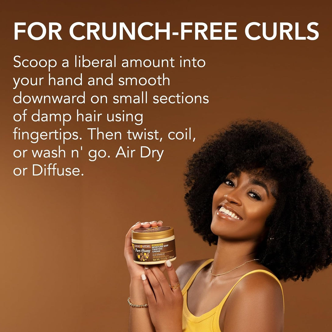 CREME OF NATURE pure honey twisting cream jar held by smiling woman with natural curly hair for crunch free curls