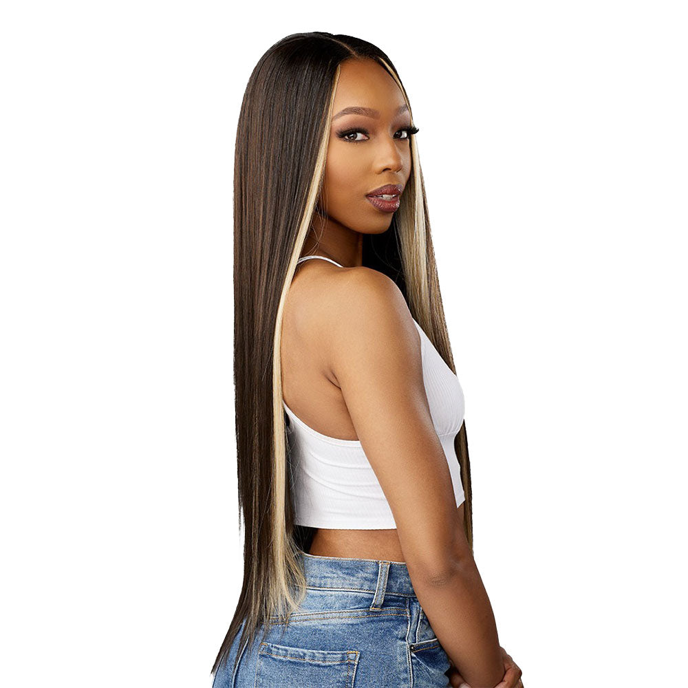 SENSATIONNEL straight 18 inch wig with black and blonde highlights worn by a woman in white top and jeans