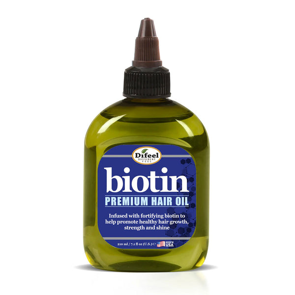 Difeel biotin hair oil for hair growth green squeeze bottle labeled premium hair oil for stronger hair