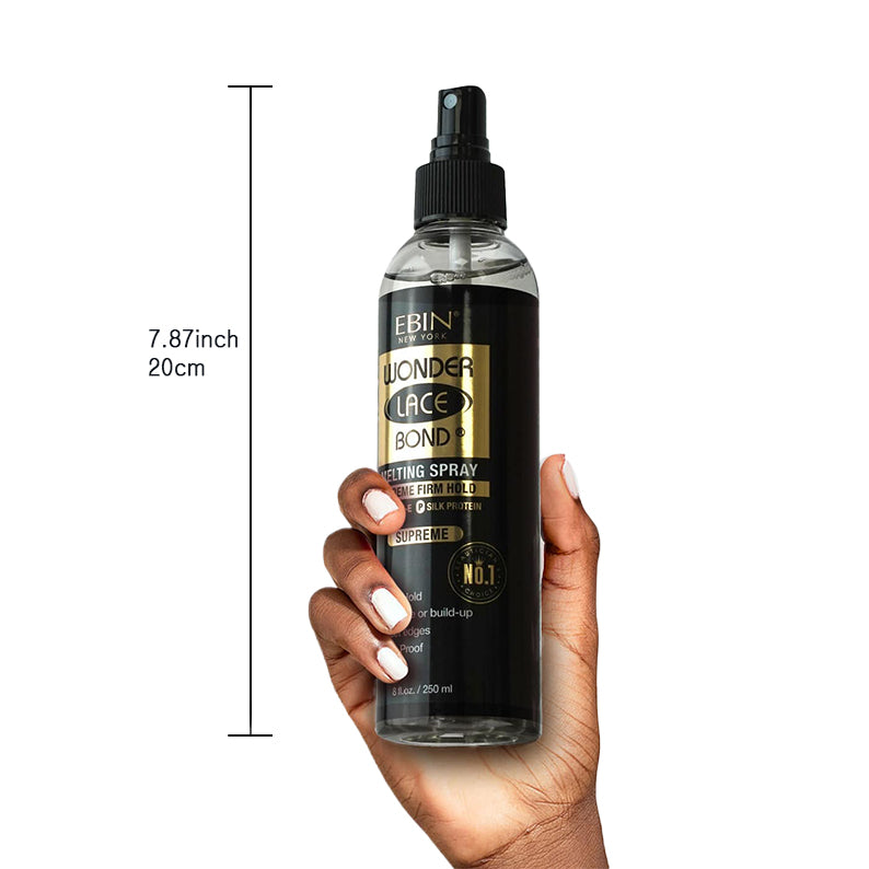 EBIN lace wig adhesive spray bottle held in hand with black and gold label and spray nozzle
