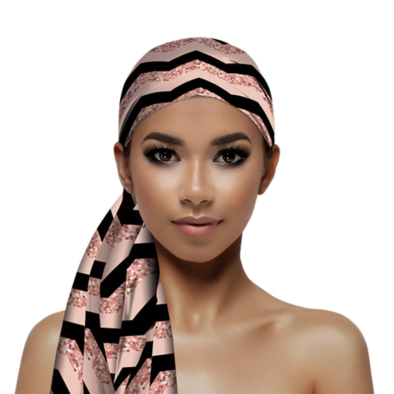 FIRSTLINE silky wrap scarf for hair in pink and black chevron pattern worn as head wrap on model