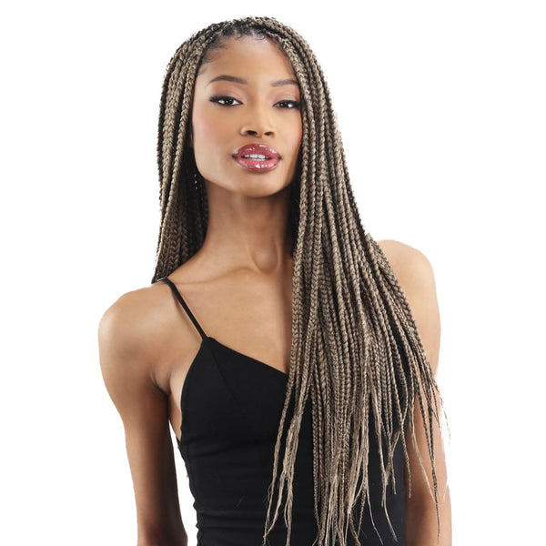 Model wearing long blonde box braids with natural part Freetress 3X Braid 301 hair extensions by SHAKE N GO