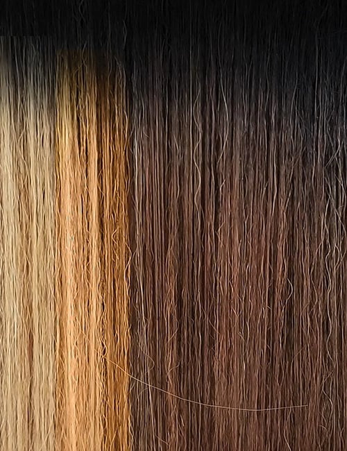 OUTRE 32 inch straight lace wig close up showing dark roots to caramel blonde ombre straight hair strands