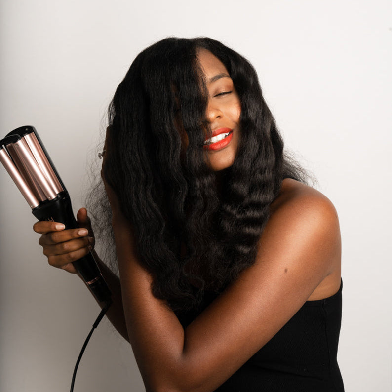ANNIE 4-in-1 hair waver used by woman styling long natural hair for beachy waves and volume