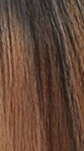 Close up of brown ombre wig hair showing fine texture and lace edge HD lace wig with natural hairline