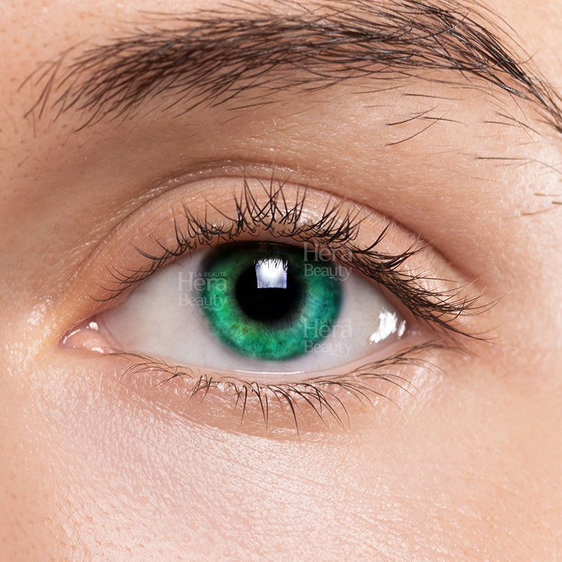 Close up of eye wearing LIZ jade green color contact lenses showing vibrant natural iris detail