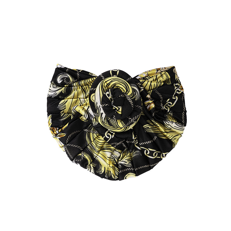 ANNIE silky top knot turban in black and gold with intricate chain and feather pattern