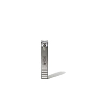 NICKA K stainless steel large curved nail clipper standing upright on white background with shadow