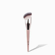 NICKA K angled foundation brush with dense synthetic bristles and rose gold handle