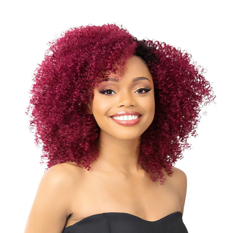 Smiling model wearing ITS A WIG BFF human hair blend half wig burgundy tight curly shoulder length volume