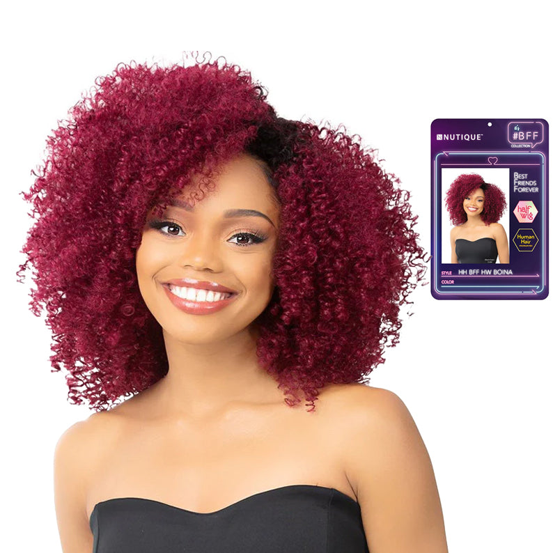 Smiling model wearing burgundy curly BFF human hair blend half wig shoulder length voluminous style