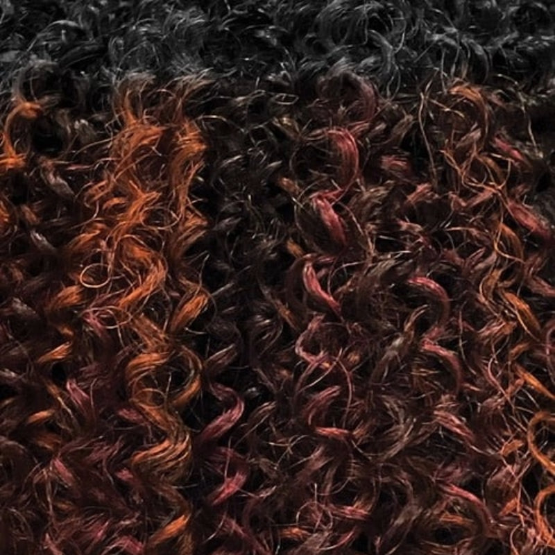 OUTRE bohemian curl clip in hair extensions close up of tight black curls with auburn and burgundy highlights