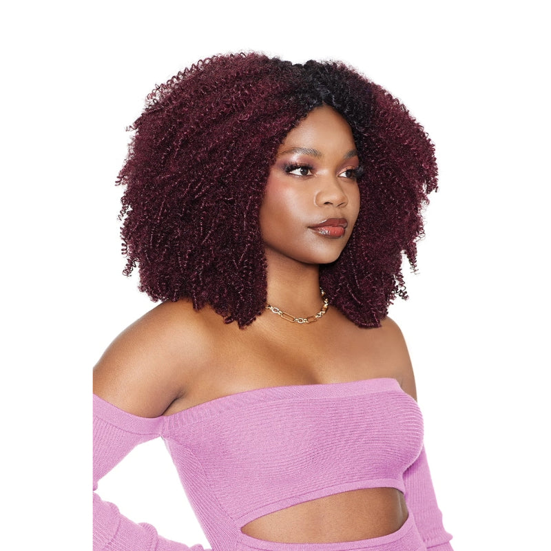 OUTRE Brazilian coily hair weave burgundy with natural black roots on model in off shoulder pink top