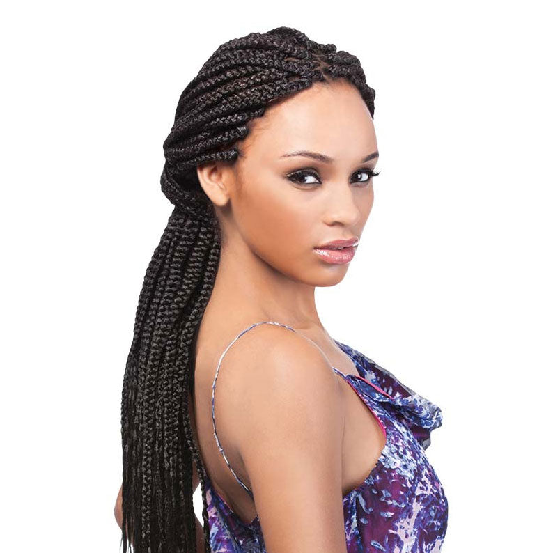 OUTRE jumbo braid hair extensions styled in long, thick braids on a woman wearing a purple patterned top
