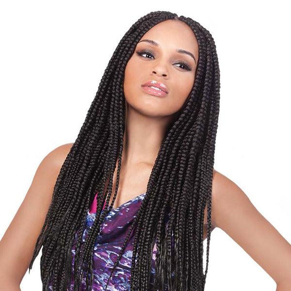 Woman with long black jumbo braid hair extensions by OUTRE wearing a purple patterned top