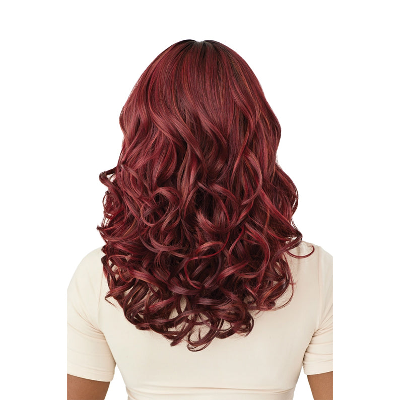 OUTRE Malina 18 inch synthetic wig. Back view deep burgundy layered curls on model