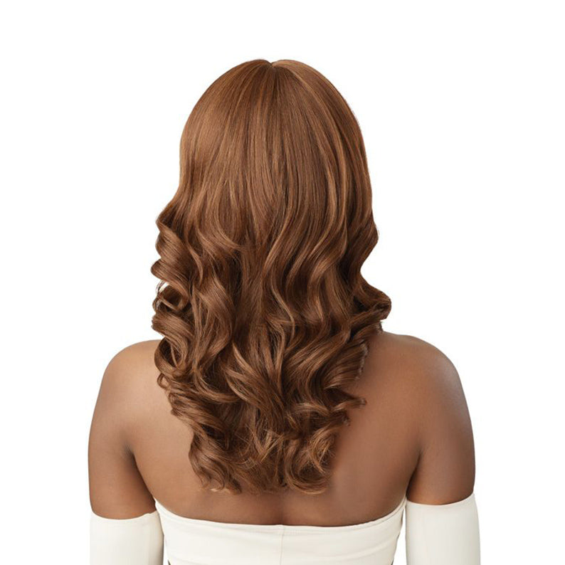 OUTRE synthetic full cap wig 20 inch in warm chestnut brown with soft waves shown from back on model