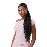 OUTRE water wave wrap ponytail extension on model with sleek edges and long natural black waves