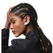 Model wearing cornrow braids decorated with gold star charms and rings braid charm kit for hair by RED BEAUTY by KISS