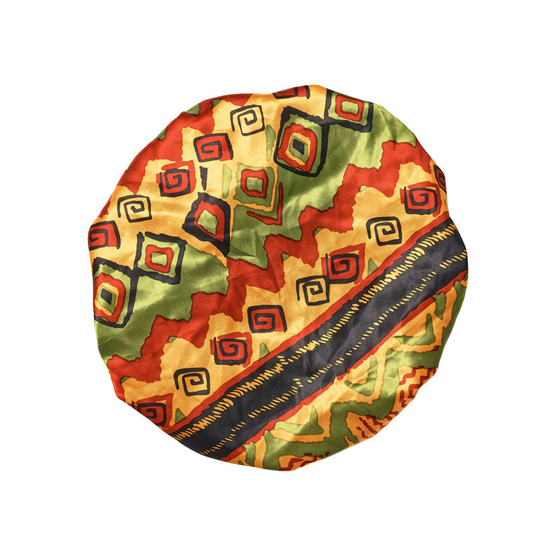 RED BEAUTY by KISS extra large silky bonnet for braids with vibrant African geometric print in red green and yellow