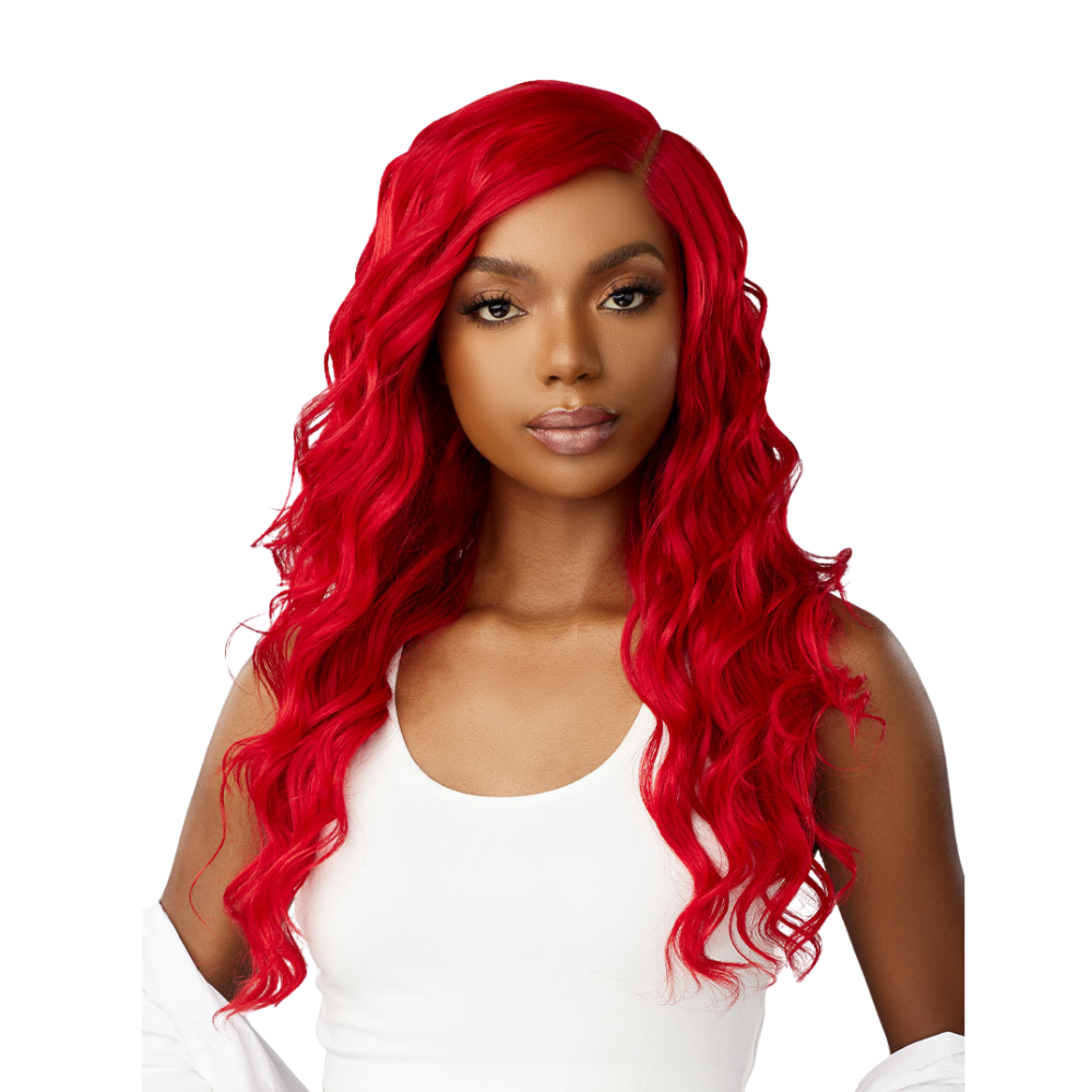 SENSATIONNEL red curly synthetic wig styled in loose waves on a woman wearing a white top