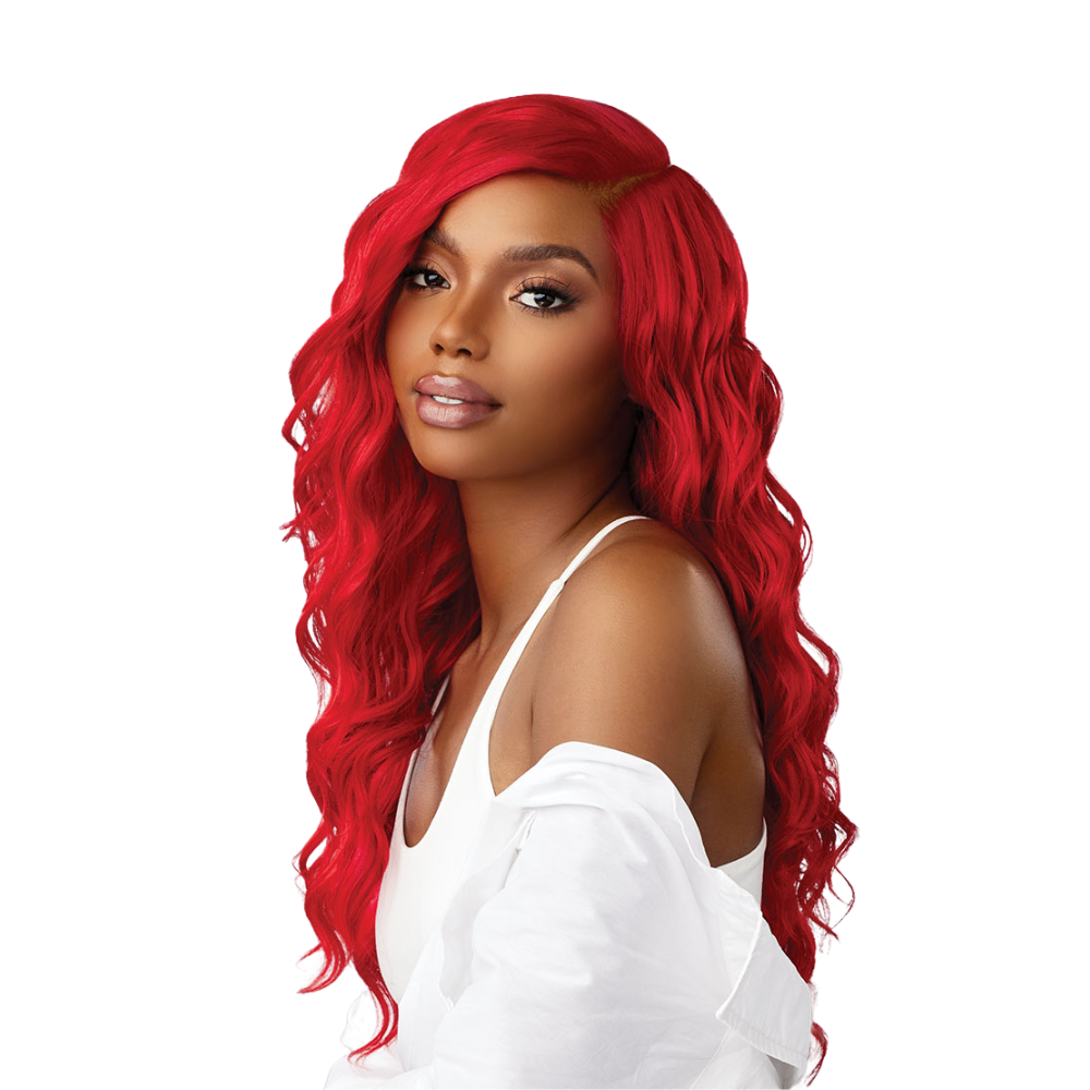 SENSATIONNEL red curly synthetic wig worn by woman with long vibrant red curls