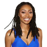 SENSATIONNEL 8 inch loc extensions styled on a smiling woman wearing a blue top