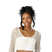 SENSATIONNEL Lulu Bun Updo wig on model with curly high bun and face framing tendrils in black
