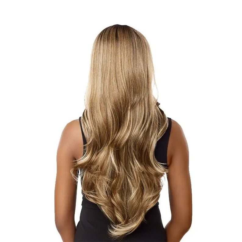 Sensationnel Vice HD Lace Front Wig long honey blonde wavy hair with dark roots back view on model