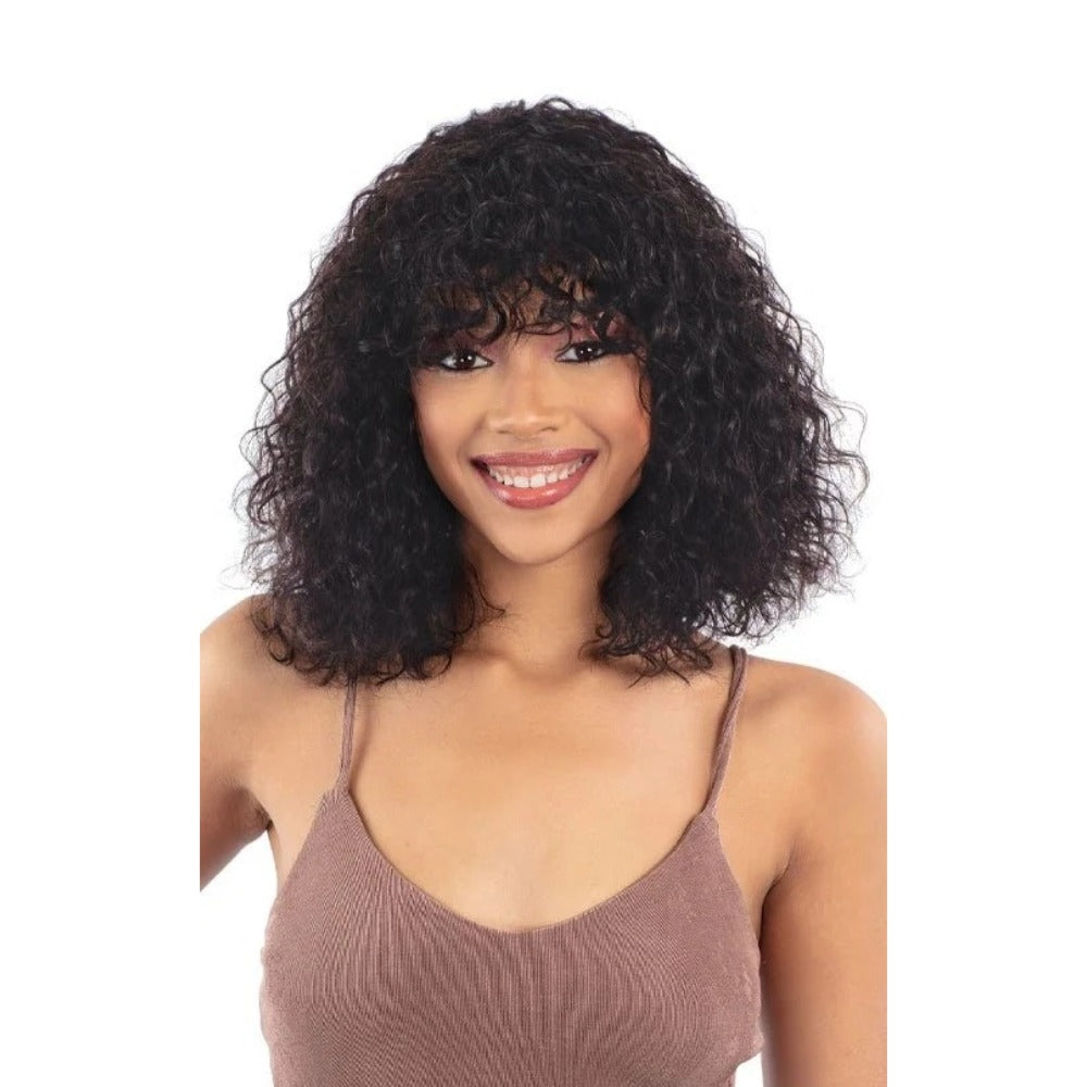 Shake N Go golden human hair wig shoulder length curly with bangs shown on smiling model for everyday natural look