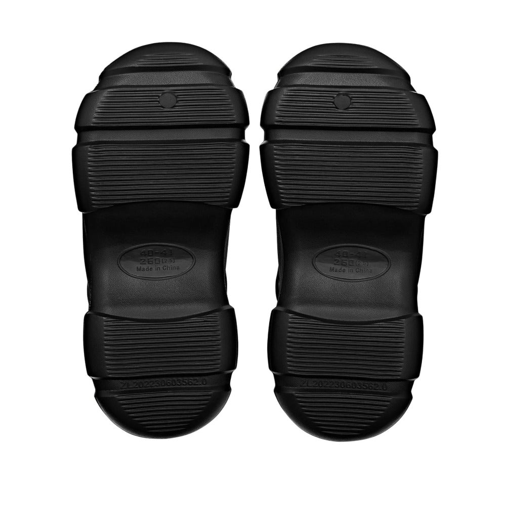 RED BEAUTY by KISS black air clog sandals showing textured slip resistant rubber soles bottom view