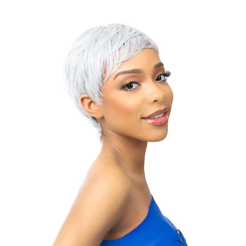 Model wearing ITS A WIG short silver pixie synthetic full cap wig side profile smiling in blue dress