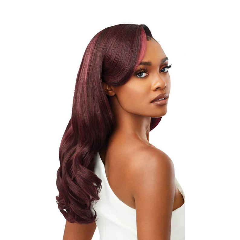 Outre wig with long wavy burgundy hair styled with side bangs on a model