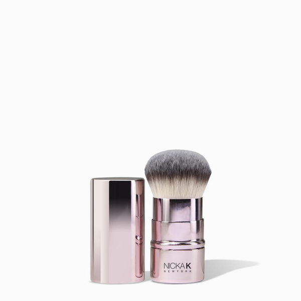 NICKA K retractable rose gold kabuki makeup brush with dense synthetic bristles and protective cap