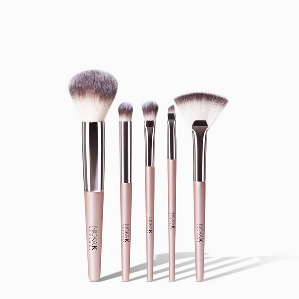 NICKA K face essential brush set five pink handled makeup brushes including powder fan and detail brushes