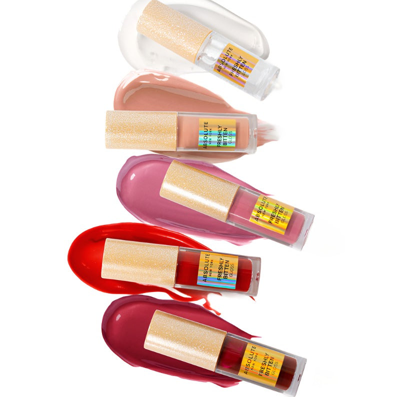 Absolute New York hydrating lip gloss collection in various shades with glossy swatches on white background