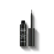 ABSOLUTE NEW YORK black eyelash adhesive with brush open tube and thin applicator wand on white background