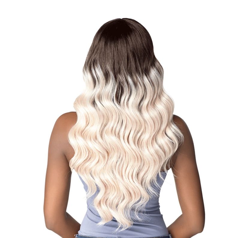 Back view of SENSATIONNEL Instant Fashion Dashly full cap wig long wavy ombre dark roots to platinum