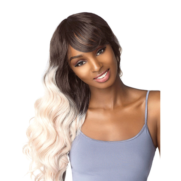 Model wearing SENSATIONNEL Instant Fashion Dashly full cap wig long wavy brown to blonde ombre with side bangs