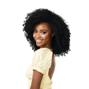 OUTRE synthetic curly half wig in natural black on smiling model with voluminous defined coils for easy styling
