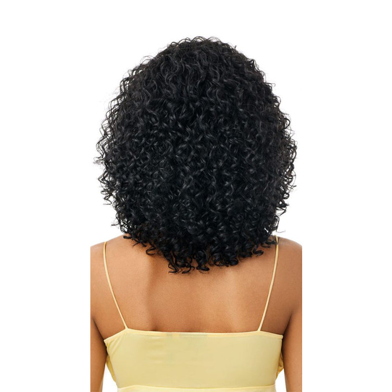 OUTRE synthetic half wig beach waves in natural black curly shoulder length shown on model back view
