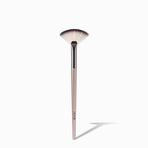 NICKA K mini fan makeup brush with soft fan bristles and slim pink handle for highlighting