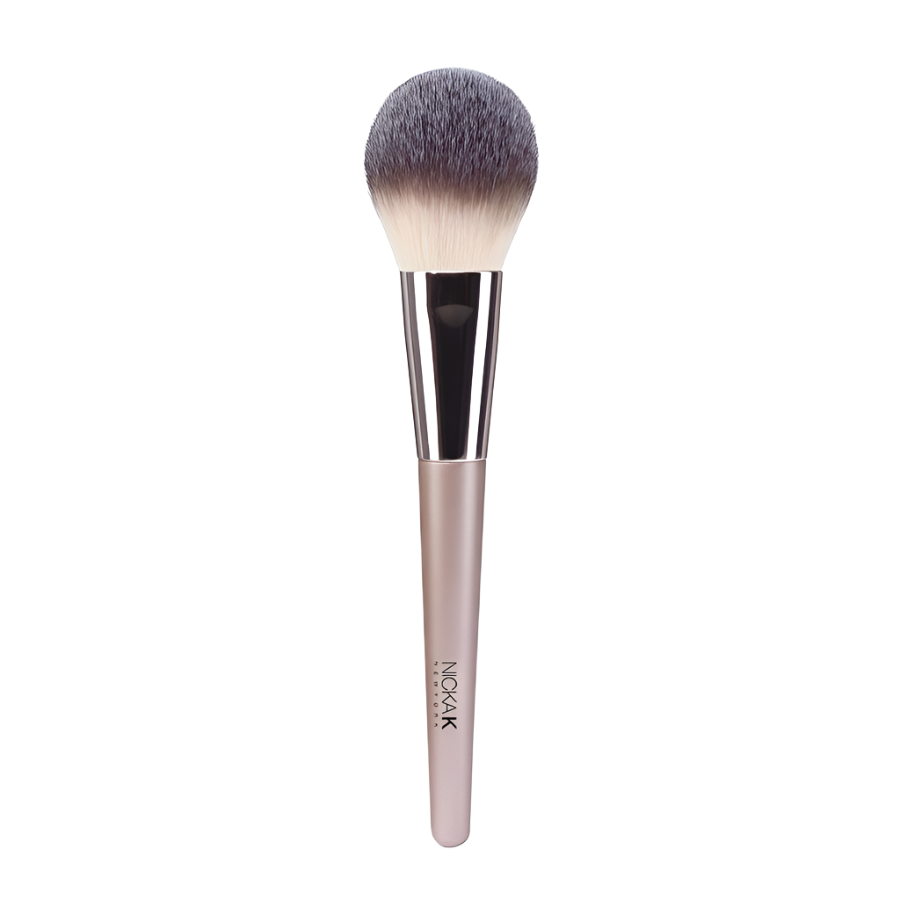 NICKA K powder brush for makeup with soft dense grey tipped bristles and pale pink ergonomic handle