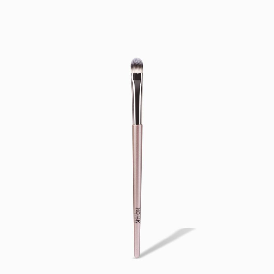 NICKA K round eyeshadow brush with dense rounded synthetic bristles and pink metallic handle